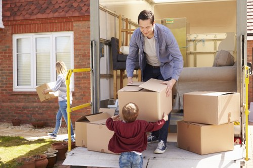 House removal team loading boxes and furniture for a local St Johns Wood move