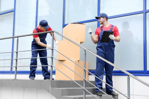 Careful loading of boxes and household items from a local flat building