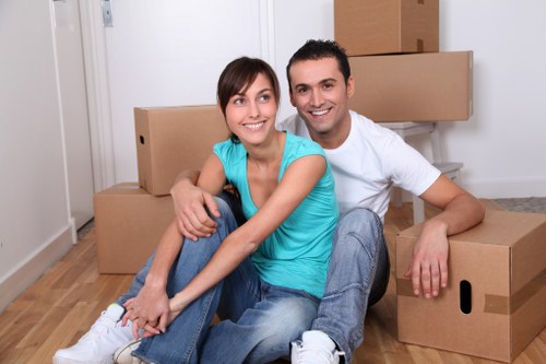 Movers handling furniture in a St Johns Wood apartment block
