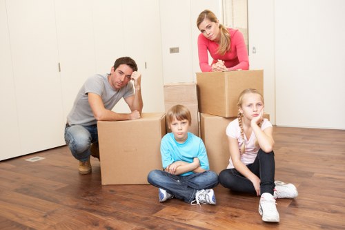 Movers handling furniture and boxes during a same-day relocation in St Johns Wood