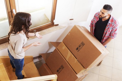 Professional movers handling commercial equipment during a local relocation