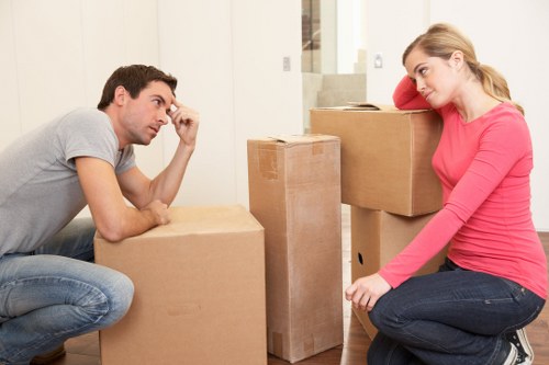 Careful loading of sofas and cabinets for transport in NW8