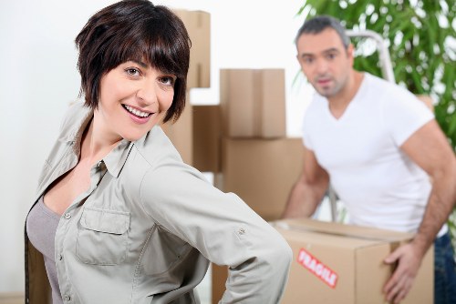 Movers securing items safely inside a transport vehicle