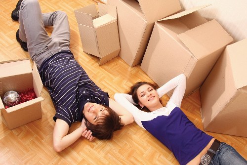 Packers handling boxes and furniture for a house move