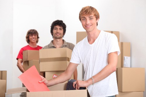 Preparation for a student relocation with labeled boxes and essentials